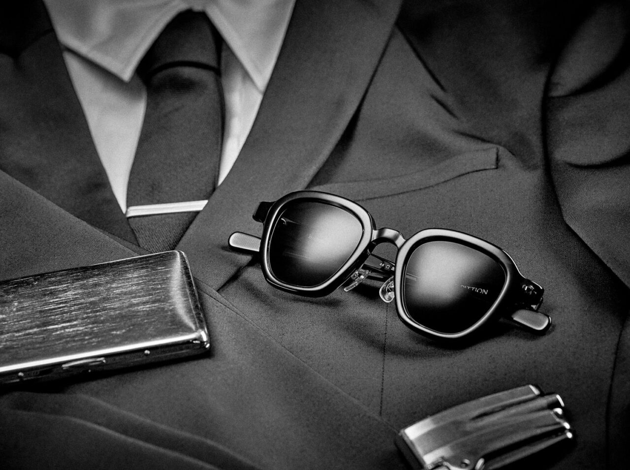 Editorial photo shoot featuring Max Pittion eyewear. Man in black eyewear